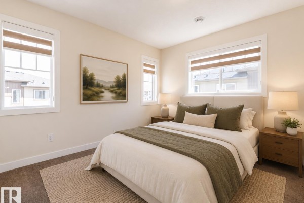 Bedroom with a queen-size bed, two nightstands, and neutral-toned decor. - #81 1530 Tamarack Bv Nw, Edmonton