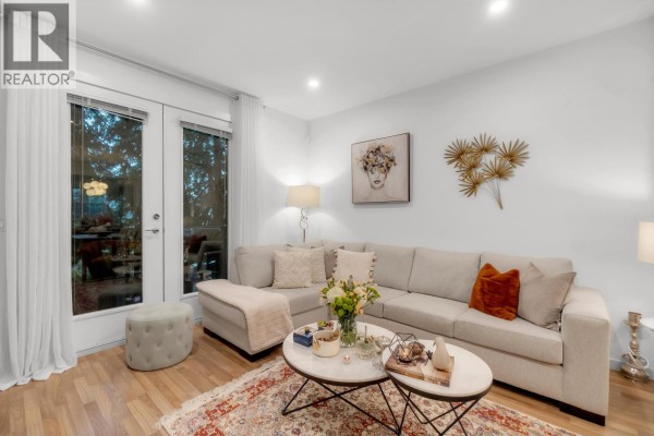 Cozy living room corner with coffee table and decorative accents - 81 688 Edgar Avenue, Coquitlam