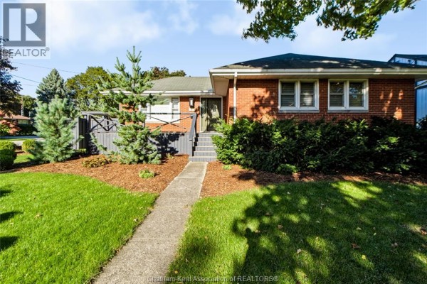 Front exterior of a red brick bungalow with a walkway leading to the front door and a wooden deck. - 81 Devon Road, Chatham