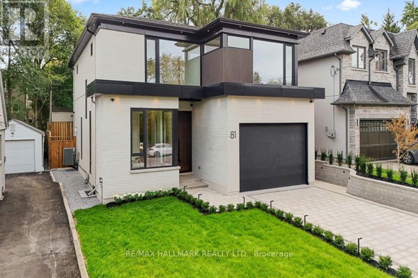 Exterior view of modern two-story house at 81 Meadowview Avenue with white brick, black accents, and garage. - 81 Meadowview Avenue, Markham