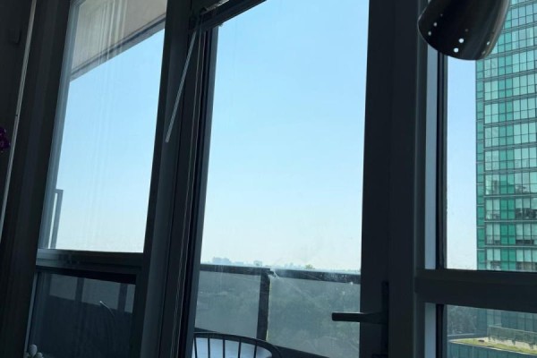 Balcony with city view, chair, table, window, and door - 811 - 2 Anndale Drive Toronto
