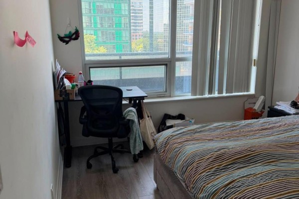 Bedroom with city view window, desk, and bed - 811 - 2 Anndale Drive Toronto
