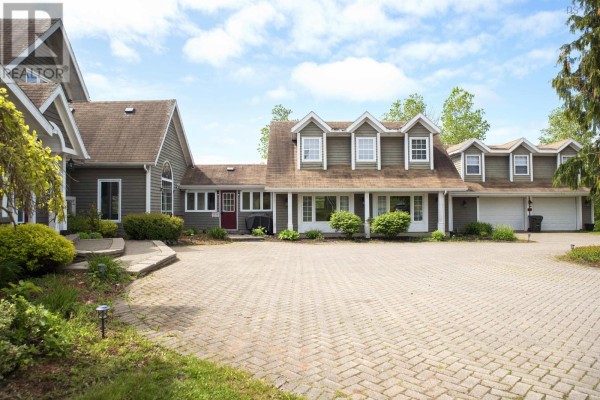 U-shaped kitchen with light wood cabinetry, white appliances, and a checkered floor pattern. - 815 Coxheath Road, Coxheath