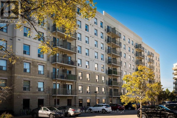 Close-up view of the exterior of a modern apartment building with balconies. - 818 - 239 Auburn Drive, Waterloo