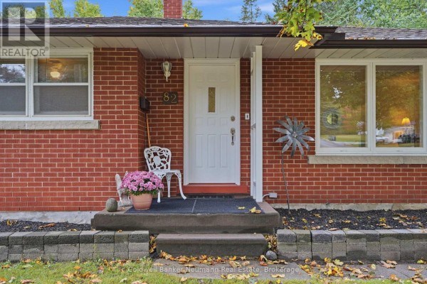 Close-up of the front entrance with a white door and brick facade. - 82 Knightswood Boulevard, Guelph