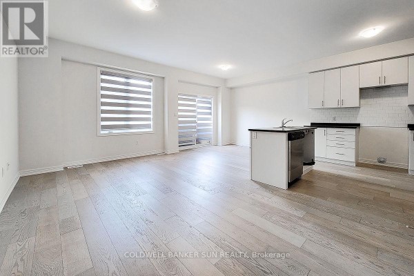 Walk-in shower with white tiled walls, glass door, and chrome fixtures in a bathroom. - 82 Pinot Crescent, Hamilton