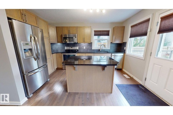 Family room - 821 36a Av Nw, Edmonton, AB T6T0S5 Photo 4