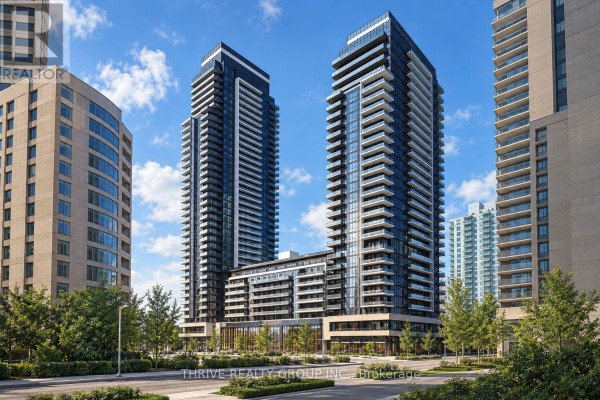 Exterior view of two modern residential towers with balconies and glass facades. - 823 - 100 Fullarton Street, London East