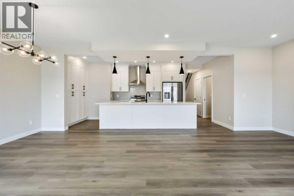 Den - 825 Baywater Place Sw, Airdrie, AB T4B3V3 Photo 4