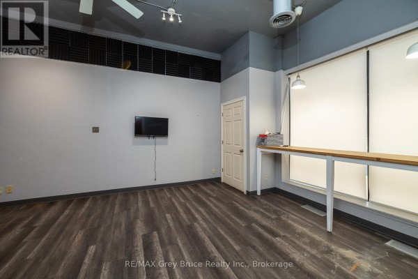 View of the interior highlighting orange wall and entrance to another room. - 827 2nd Avenue E, Owen Sound