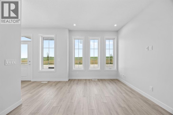 Living room - 83 Hotchkiss Way Se, Calgary, AB T3S0V2 Photo 5
