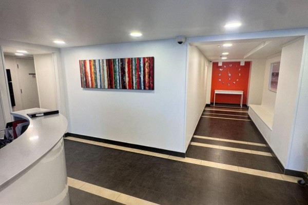 Reception desk area with contemporary artwork on the wall. - 830 - 15 James Finlay Way, Toronto