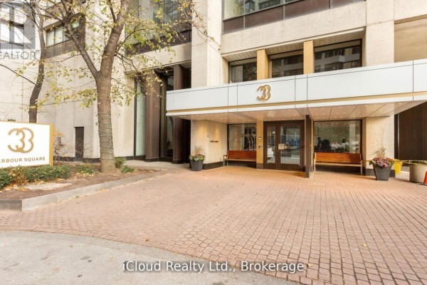 Entrance to 33 Harbour Square with a covered walkway and paved entryway. - 837 - 33 Harbour Square, Toronto