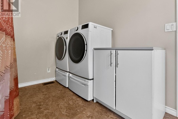 White washer and dryer with white cabinets - 84 Highway 11 Highway E Hearst