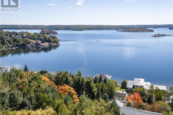 View of a large lake with islands and forested shores with autumn foliage. - 84 Neelon Avenue, Sudbury