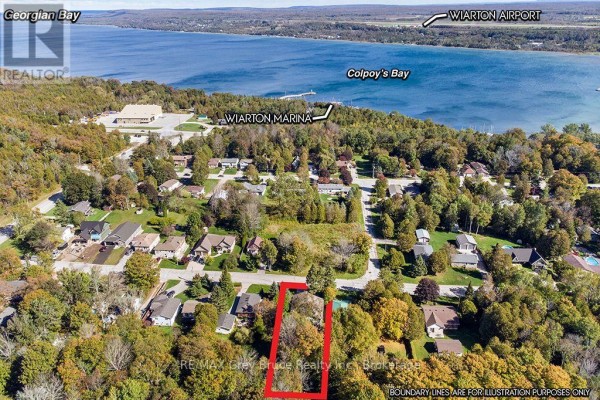 Aerial view of a residential neighborhood with a large bay in the background. - 840 Mcnaughton Street, South Bruce Peninsula