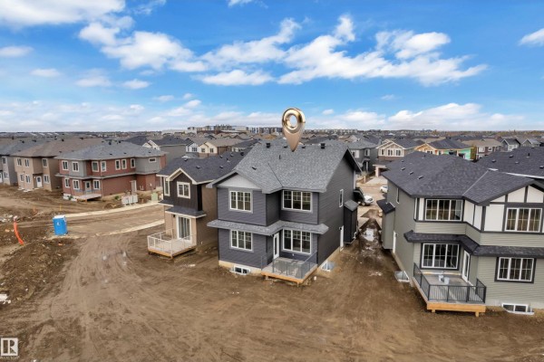 Main floor plan blueprint showing living room, kitchen, dining, office, and garage layout. - 8422 223a St Nw, Edmonton