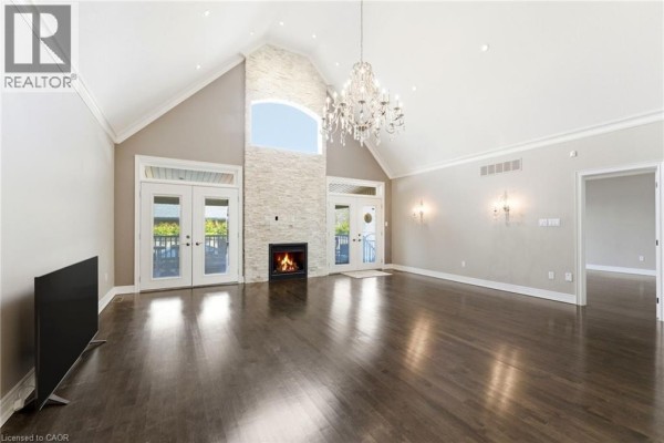 Covered patio with dining table, fire pit, grill, and seating - 85 Hillcroft Drive Stoney Creek
