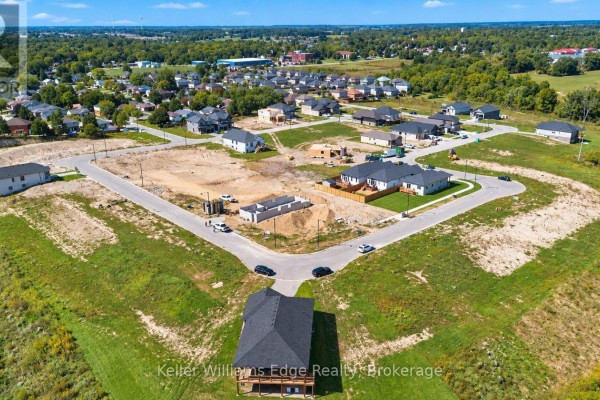 Aerial view of a residential development with several homes under construction and completed. - 85 Pike Creek Drive, Haldimand