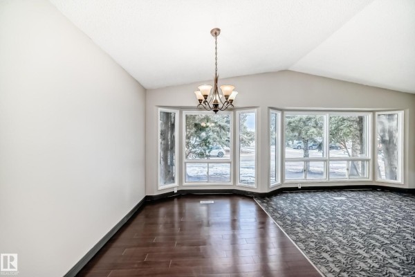 Entryway with closet, door, and natural light from skylight. - 8516 190 St Nw, Edmonton