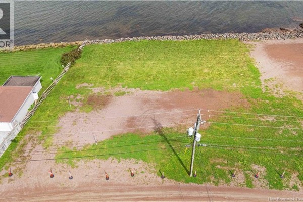 Expansive view of the ocean from the waterfront property lot. - 86 Cap Bimet Road, Grand Barachois