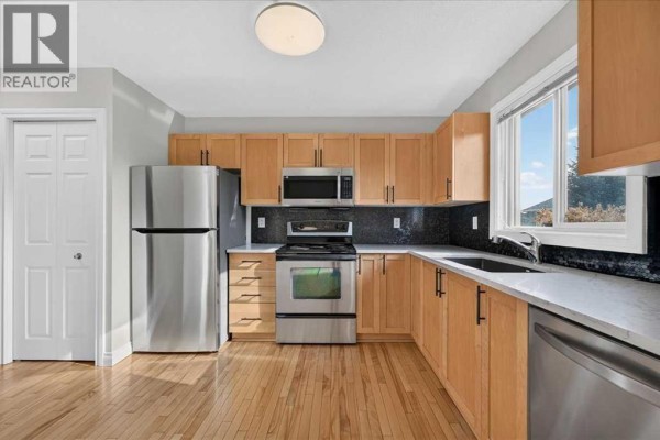 Kitchen - 86 Cedarwood Lane Sw, Calgary, AB T2W6J3 Photo 4