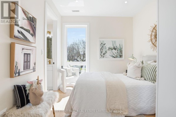 Living room with fireplace, accent chairs, and open concept dining/kitchen - 86 Edgecroft Road Toronto