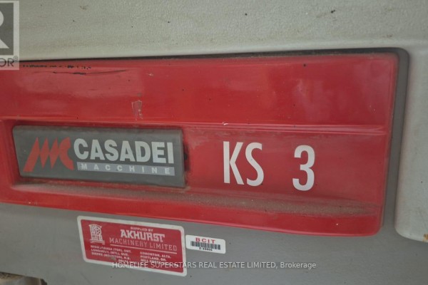 Close-up of the red and grey Casadei KS 3 label on a woodworking machine. - Unit 9 - 86 Melford Drive, Toronto