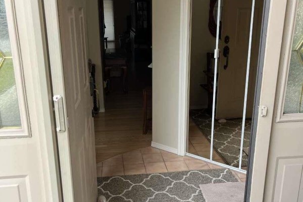 View into the townhouse entryway from the open front doors. - 860 Lanfranco Road Unit# 11, Kelowna
