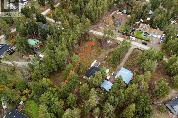 Aerial perspective of a forested property with a few houses and surrounding trees. - 861 Balsam Road, Fintry