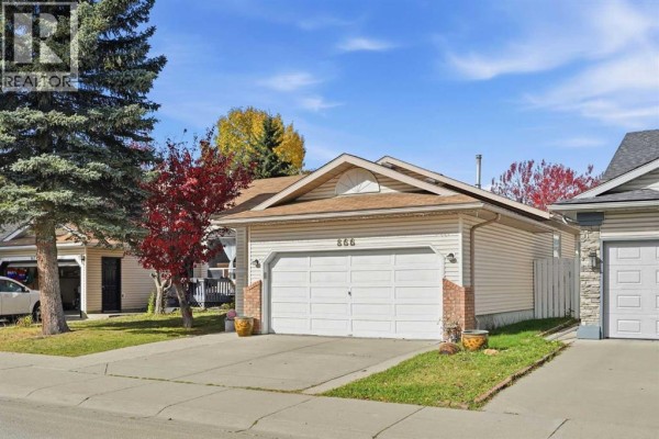 Room with wood floors, treadmill, storage shelves, and large white closets. - 866 Applewood Drive Se, Calgary
