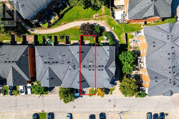 Overhead view of the townhouse units with red outlines highlighting one property. - 87 - 6950 Tenth Line W, Mississauga