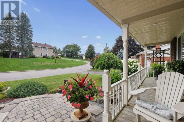 View of the property from the street showcasing the house, lawn, and landscaping. - 876 Hillsview Street, Renfrew