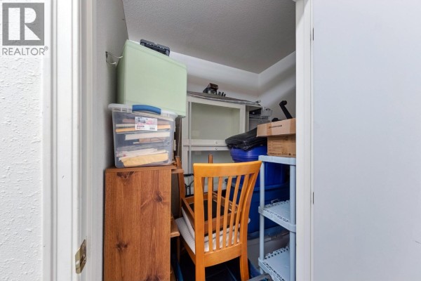 White kitchen with white cabinets, grey countertops, dishwasher, stove, and refrigerator. - 877 Klo Road Unit# 116, Kelowna