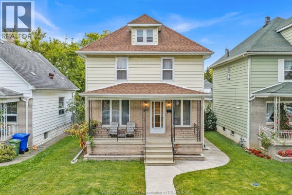 Aerial view of 877 Pierre Avenue, a two-story house with a covered front porch. - 877 Pierre Avenue, Windsor