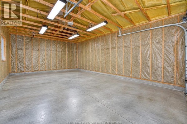 Overhead view of an entrance hall with white doors, staircase, and tiled floor. - 879 Westwood, Lakeshore
