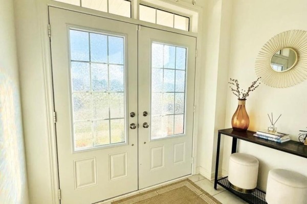 Interior hallway with white doors, carpeted floor, and view to living area. - 89 Hartley Avenue, Brant