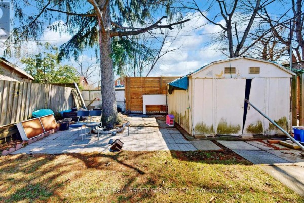 Backyard with shed and paved patio - 89 John Street Brampton