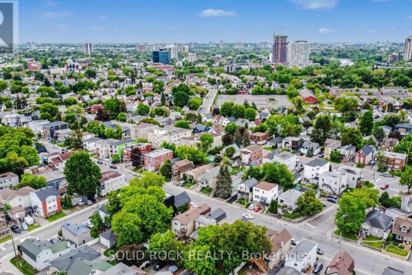 Aerial view of a residential neighborhood in Ottawa with various houses and buildings. - 89 Marier Avenue, Ottawa