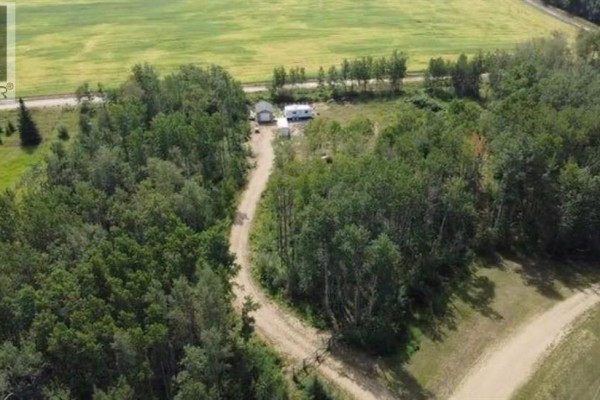 Aerial view of a property entrance with a gate and trees. - 9, 842052 Range Road 241, Rural Northern Lights, County Of