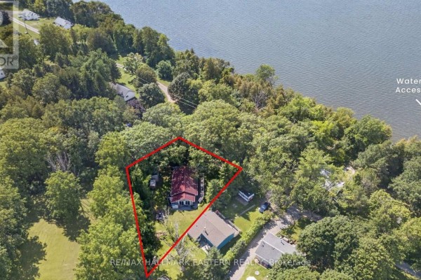 Aerial view of a residential property surrounded by trees, with a lake in the background. - 9 - 422 Island View Road, Alnwick/haldimand