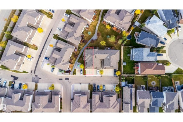 Overhead view of the duplex property showing its layout on the street with surrounding houses. - #9 445 Brintnell Bv Nw Nw, Edmonton