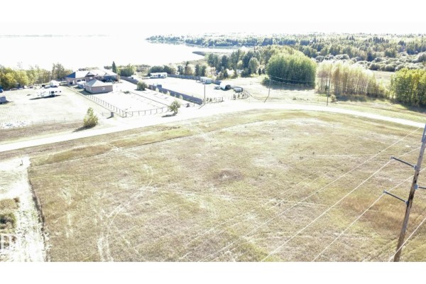 Aerial perspective showing the lot with power lines and a view of the lake. - 9 Bechthold Bay 104, 191054 Twp 852, Rural Athabasca County