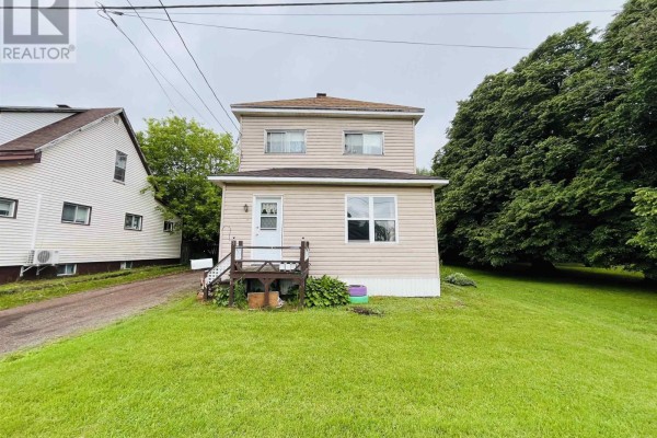 Front view of a two-story house with beige siding and green lawn. - 9 Dundonald Street, Amherst