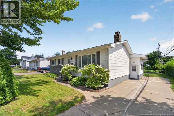 Exterior of the white bungalow with a driveway on the right side. - 9 Magellan Drive, Moncton