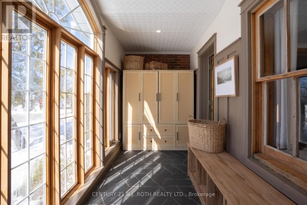 Bright entryway with large windows, storage cabinets, and slate flooring - 90 Cumberland Street, Barrie