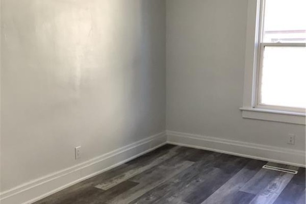 Room with light gray walls, white trim, and a window with a white frame. - 90 Kent Street S Unit# 4, Simcoe