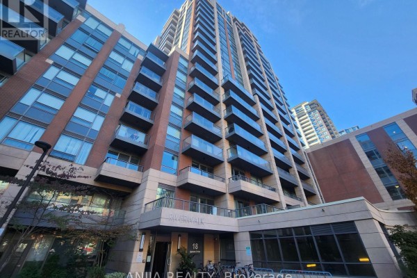 Low angle exterior view of Riverwalk building showing balconies and entrance. - 901 - 18 Uptown Drive, Markham