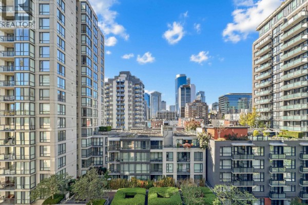 City skyline view from apartment with various modern architecture and blue sky. - 901 1055 Richards Street, Vancouver