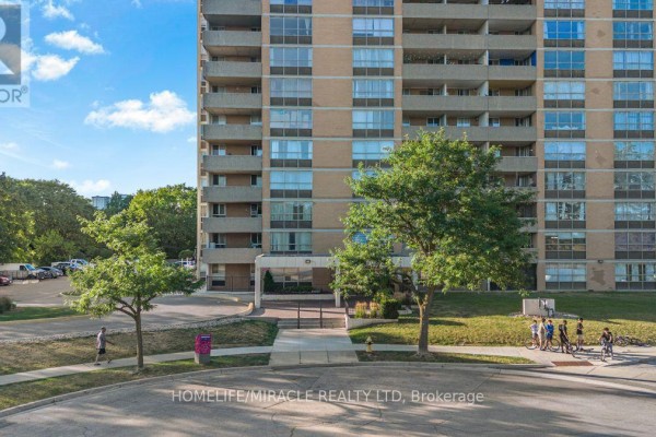 Building lobby with marble floors, wood paneling, and metal railings. - 903 - 40 Panorama Court, Toronto